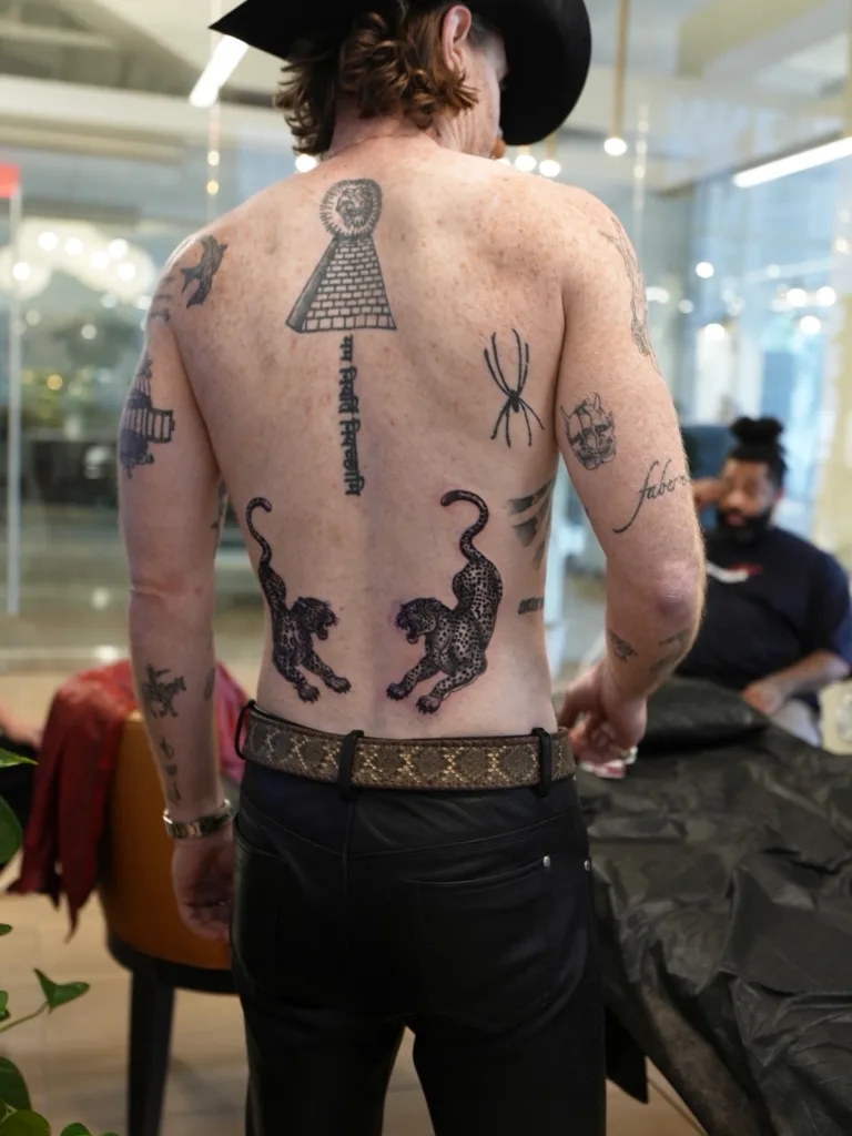 Looking for a Tattoo Shop in Nashville? What to Know Before You Book 1 Leopard back tattoos by Skin Design Tattoos Nasvhille artist Jake Ingersoll