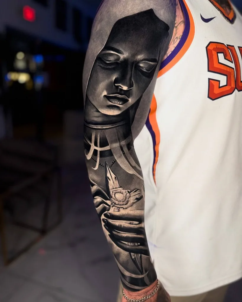 Tattoo Styles Explained: How to Find the Right One for You 1 Reworked blackout tattoo sleeve by New York tattoo artist Amanda